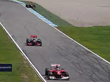Photographie de Fernando Alonso, Jenson Button et Sebastian Vettel au Grand Prix d'Allemagne