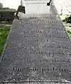 Inscription sur la pierre tombale de Jean François Emmanuel Gadon, recteur du Trévoux entre 1867 et 1898.