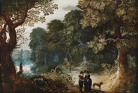 Couple élégant promenant travers la forêt.