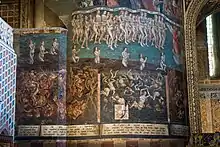 photo couleur d'une peinture murale représentant en bas les tourments de l'enfer et au-dessus, un ange accueille mes âmes au Paradis.