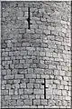 Archère à deux demi-croisillons décalés du château d'Aulnay.