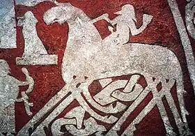 Détail sur l'image d'un cavalier chevauchant un cheval à huit jambes sur la pierre de Tjängvide