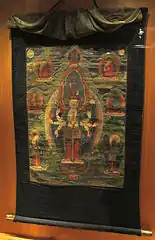 Avalokiteshvara sous la forme d'Ekadashamukha. Tibet, XIXe&nbsp;siècle. Thangka, détrempe sur toile, bordure soie, H. 49 x L. 35,5&nbsp;cm.