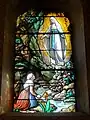 L'apparition de la Vierge à Bernadette Soubirous.