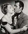 Avec James Craig, dans Le Rocher du diable (1951, photo promotionnelle)