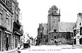 Baud : l'ancienne église Saint-Pierre et la place de l'Église au début du XXe&nbsp;siècle (carte postale).