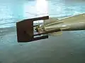 Dispositif permettant de guider la torpille en mode vertical jusqu'à l'eau