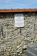 Plaque du Souvenir français à l'endroit où il est tombé.