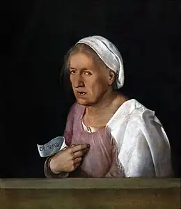 Image d'une peinture représentant sur un fond sombre, derrière un parapet, une femme âgée représentée en demi-figure de trois quarts, tournée vers la gauche qui regarde le spectateur en ouvrant la bouche et tenant un parchemin dans sa main droite qui repose sur la poitrine. Elle porte un béret blanc, qui laisse à découvert une touffe de cheveux gris et une robe rose, ainsi qu'un tissu blanc avec des franges sur l'ourlet qui repose sur son épaule.