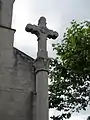 Croix ouvragée située devant l'église, don de J. Auclair, maire de Saint-Maurice-les-Châteauneuf, elle&nbsp;est l'œuvre du tailleur de pierres Burthier ;  bénie le 9 mai 1888 par Mgr Perraud, évêque d'Autun.