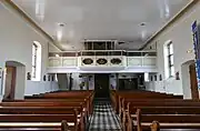Vue intérieure de la nefvers la tribune d'orgue.