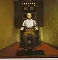 Figure de cire de Bruno Richard Hauptmann sur une chaise électrique.