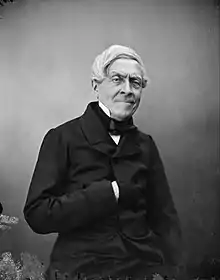 Photo en noir et blanc de Michelet, la main dans le gilet.