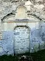 Porte bouchée à l'ouest du bas-côté sud.