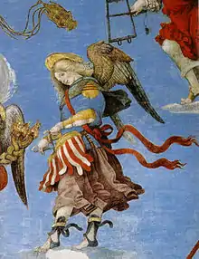 Image au centre d'un ange ailé jouant du tambourin avec un long vêtement coloré sur un fond bleu.