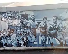 Affiches de la Bodega des supporters avec, à droite, le capitaine Francis Rui ballon en main, et à gauche, le Brennus polémique, à Pierre-Antoine.