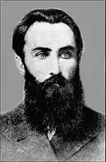 Portrait d'homme, barbu, le visage fin et le regard clair