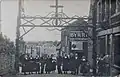 Habitants de Guénin lors d'une fête vers 1920 (carte postale).