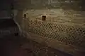 Pièce intérieure. Sol dallé en opus spicatum, mur en opus mixtum