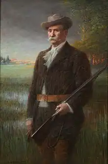 Henry Vasnier est représenté debout, un fusil à la main, devant un marais. Au loin, la gare, le village de Prunay et le fort de Nogent apparaissent.
