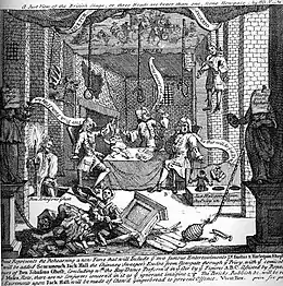 une scène, désordre indescriptible, marionnette de pendu jouant de la viole, homme tenant une torche, trois hommes autour d'une table avec des bulles allongées contenant leurs répliques ; au premier plan, au milieu d'objets renversés, homme tenant une jarre