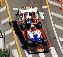 Photo de la Footwork FA16 de taki Inoue sur une remorque, à Monaco