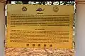 Panneau d'information en thaï et anglais sur le temple de Wat Chang Lom