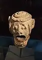 Fragment de tête d'un récipient