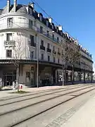 Îlot d'immeubles signés sur façade Abel Boudier en 1883.