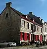 Extension de classement du mur de clôture du jardin et de la porte, situés à l'arrière de l'immeuble sis place Saint-Georges, n°31 à l'ensemble de celui-ci, c'est-à-dire façades, toiture et pignon.