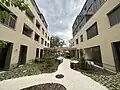 Logements bas carbone, en structure bois et isolants biosourcés, vue cour intérieure