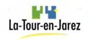 Le logo de la commune composé d'un symbole vert et bleu avec, en dessous de ce-dernier, le nom du village.