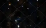 Vu élargie sur la  constellation d'Orion en couleur (DSS) la croix rose marque l'emplacement de ψ1 Orionis - CDS Strasbourg
