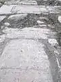 Pavement de pières tombales vestiges de la réalisation du film La Liste de Schindler