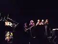 Philippe Bussonnet (basse) et les chanteurs Vander, Feuillebois, et Paganotti