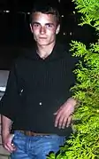 Martin McCann interprète Romus Valton Burgin (en)