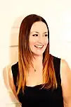 Natalie Hemby smiling while looking to her left.