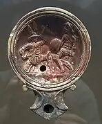 Lampe à huile représentant deux gladiateurs combattant