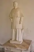 Sculpture de Preng Doçi (en) sur le portique de l'église d'Orosh en 2018