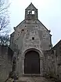 Arc triomphal transformé en mur-pignon du chœur. À gauche, on voit les premières marches de l'escalier qui montait aux combles.