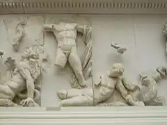 homme nu terrassant un géant à terre