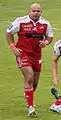 Un joueur de rugby de face, à la course