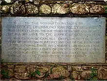 Memorial stone with carved inscription