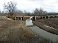 Pont ferroviaire enjambant la rivière aux Vases.