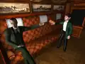 Holmes tendant le bras pour que Hercule Poirot lui donne sa boîte.