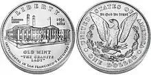 Les deux faces d'une pièce de monnaie. Sur l'avers un bâtiment industriel, sur le revers un aigle héraldique.