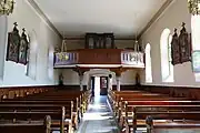 Vue intérieure de la nefvers la tribune d'orgue.