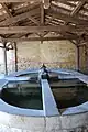 Sur le sentier de l'eau, le lavoir couvert avec quatre bassins. Chaque bassin a un bac pour le lavage et un bac  pour le rinçage. Ce lavoir à raison de 3 ou 4 membres par famille, pouvait accueillir une douzaine de lavandières qui tapaient le linge avec le « basel » (le battoir).