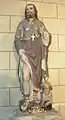 Statue de saint Roch montrant sa plaie