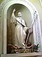 La statue de saint Bernard (1770), de l'église de Stella (Savone), mélange l'habillement et la crosse de Bernard de Clairvaux avec la chaine et le démon écrasé de Bernard de Menthon.